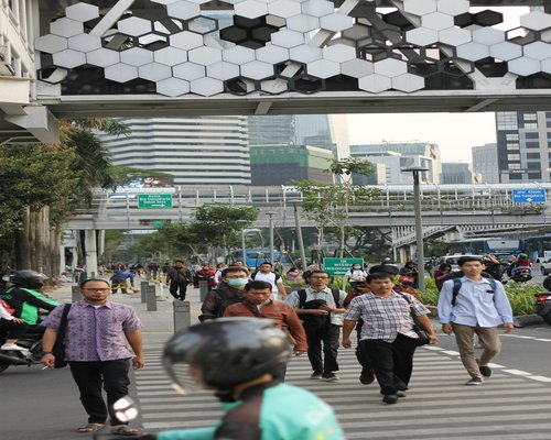 Urban commuter walking comfortably in Jakarta