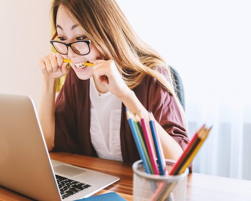 Person doing light stretching at office desk